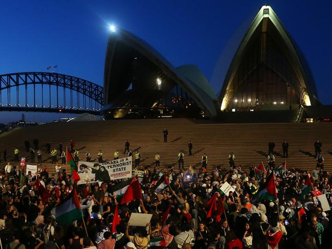 SYDNEY, AUSTRALIA - OCTOBER 09: Palestine supporters rally outside the Sydney Opera House on October 09, 2023 in Sydney, Australia. The Palestinian militant group Hamas launched a surprise attack on Israel from Gaza by land, sea, and air, over the weekend, killing over 600 people and wounding more than 2000, agency reports said. Reports also said Israeli soldiers and civilians have been kidnapped by Hamas and taken into Gaza. The attack prompted a declaration of war by Israeli Prime Minister Benjamin Netanyahu, and ongoing retaliatory strikes by Israel on Gaza killing hundreds in the aftermath. (Photo by Lisa Maree Williams/Getty Images)