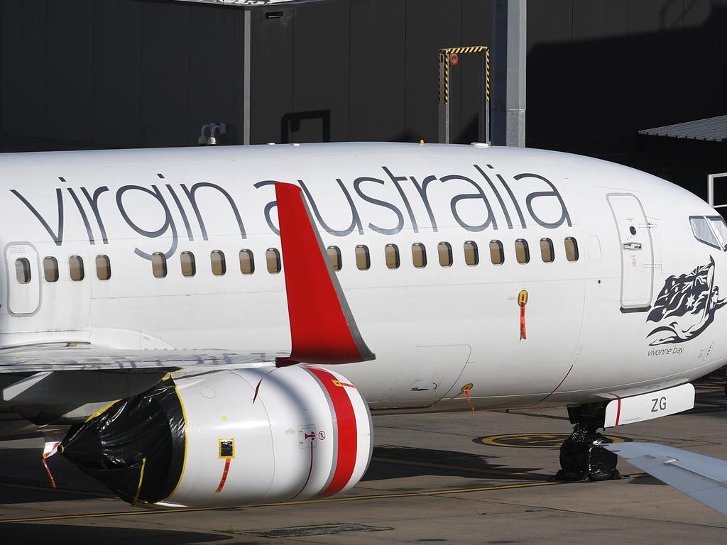 Grounded Virgin Australia planes are seen at Tullamarine Airport in Melbourne. Picture: AAP