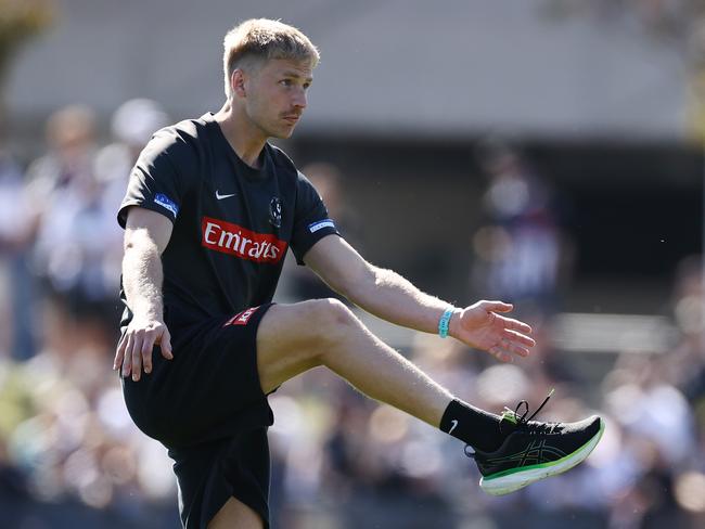 Billy Frampton warms up during Collingwood’s captain’s run on Friday. Picture: Michael Klein