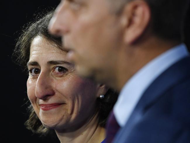 Premier Gladys Berejiklian smiles at a press conference after the Fair Work Commission ordered rail workers to suspend their strike. Picture: AAP