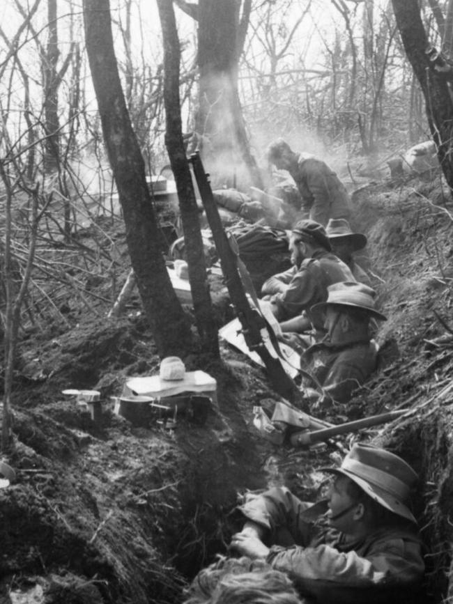 Diggers rest in a shallow trench they have just captured from the Chinese on Hill Salmon. Picture: Supplied