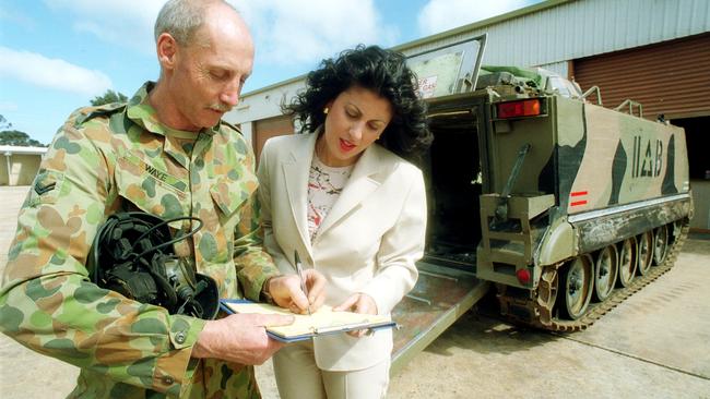 Australia Defence Force public affairs regional manager Deanna Nott (r) with Corporal Bruce Wayne at Army Unit Base in Smithfield in 2002.