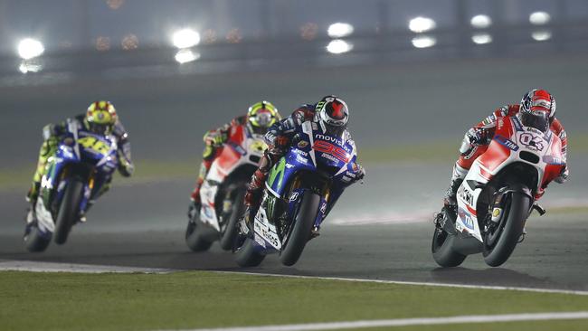 Dovizioso and Lorenzo traded the lead as Rossi closed in.