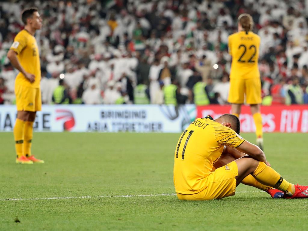 Australia's players react to their defeat during the 2019 AFC Asian Cup quarter-final football match between UAE and Australia at Hazaa bin Zayed Stadium in Al-Ain on January 25, 2019. - UAE defeated Australia 1-0. (Photo by Karim Sahib / AFP)