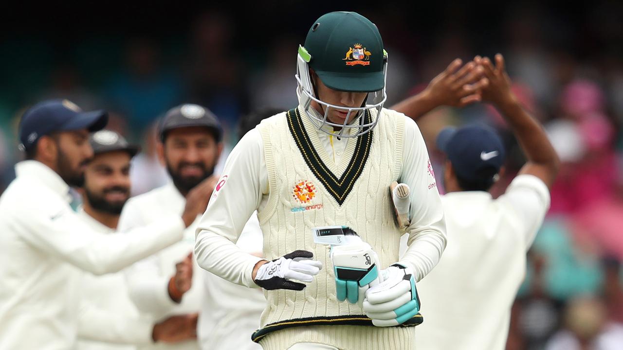 Peter Handscomb of Australia leaves the field after being dismissed by Jasprit Bumrah of India.