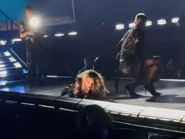 The Material Girl fell after one of her dancers appeared to trip over the chair.