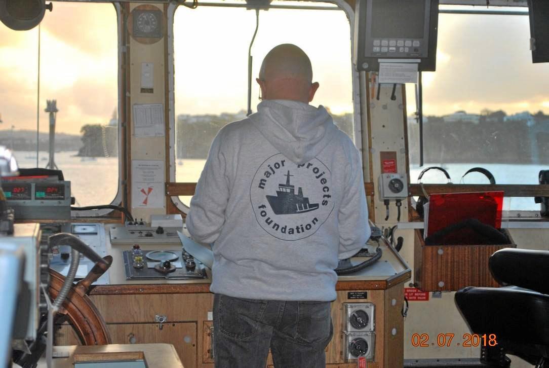 Pat Miller at the helm of the HMNZS Manawanui as the Major Projects Foundation takes over control of the former navy dive tender. Picture: Contributed