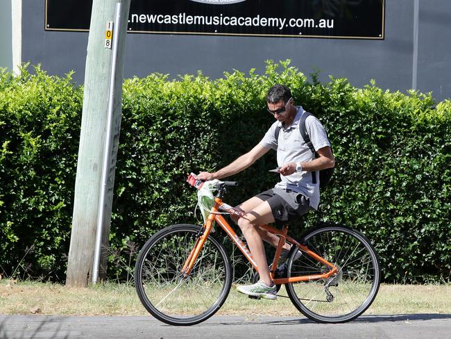 Using mobile phones will in the future earn cyclists an on-the-spot fine. Picture: Peter Lorimer