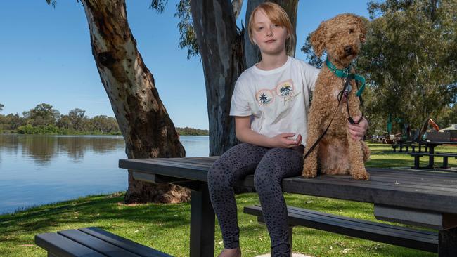 Kids at Mannum talk about the impending floods – Layla Barney, 10 with her dog Coco. Picture: Naomi Jellicoe