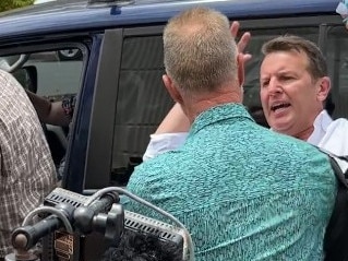 Former Territory Senator Nigel Scullion clashes with A Current Affair reporter Steve Marshall outside court. Picture: Elise Graham