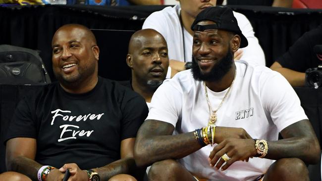 LeBron James at a Summer League quarterfinal between his new team the LA Lakers and Detroit Pistons alongside Randy Mims.