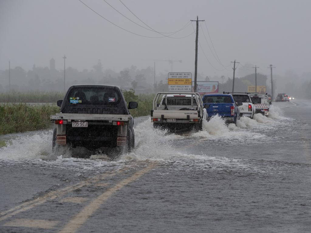 Motorists brave flood waters on the Sunshine Coast. Picture: Brad Fleet