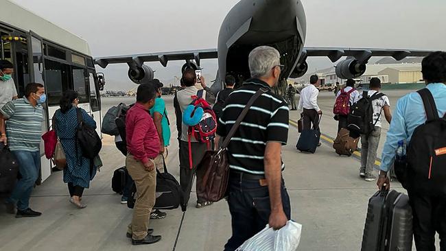 Indian Nationals prepare to board an Indian military aircraft at the airport in Kabul to be evacuated after the Taliban’s stunning takeover of Afghanistan. Picture: AFP