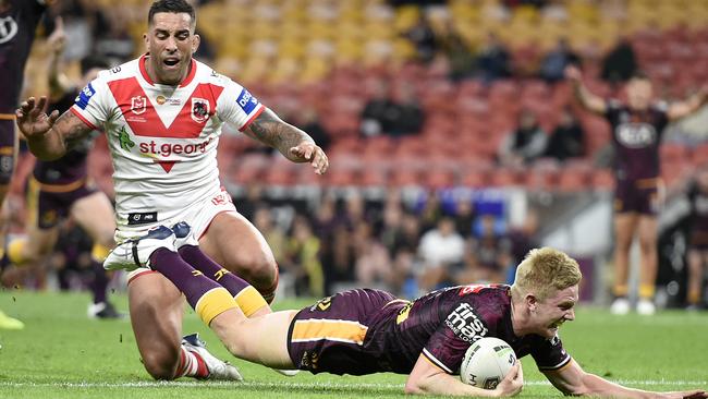 Going places: Tom Dearden scores a try against St George at Suncorp Stadium.