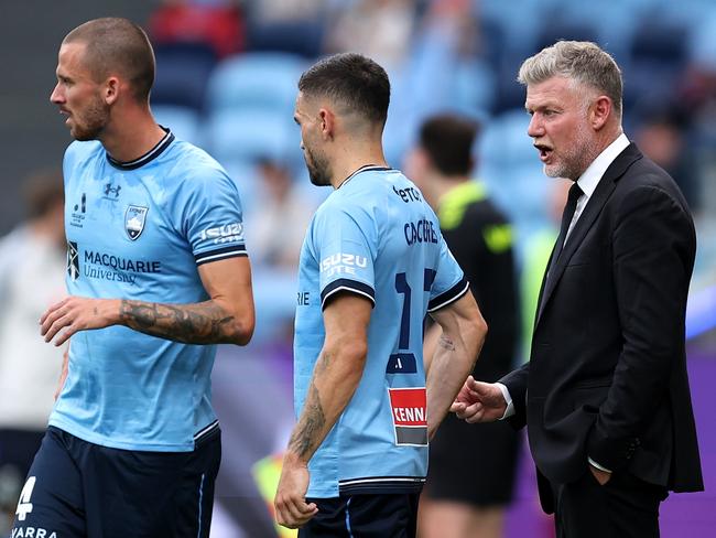 SYDNEY, AUSTRALIA - JANUARY 18: Sydney FC coach, Ufuk Talay speaks with Anthony Caceres during the round 15 A-League Men match between Sydney FC and Brisbane Roar at Allianz Stadium, on January 18, 2025, in Sydney, Australia. (Photo by Brendon Thorne/Getty Images)