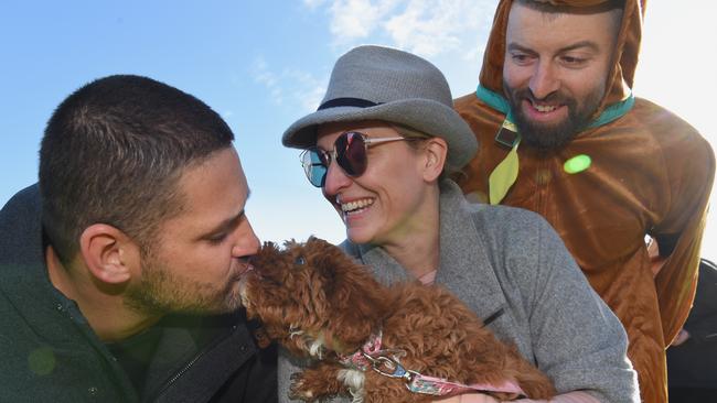 Brendan Fevola gets a kiss from Fi-Fi’s dog Lizzie-Rose. Picture: Nicole Garmston