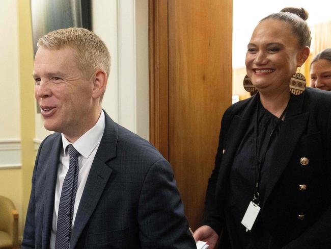 Chris Hipkins (C) and Social Development Minister Carmel Sepuloni (back) leave the Labour caucus meeting to elect a new premier at Parliament in Wellington on January 22, 2023. (Photo by Marty MELVILLE / AFP)