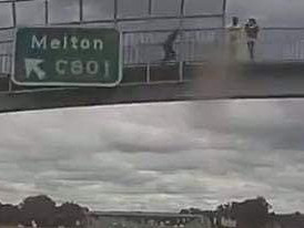 The rocks were hurled over a highway overpass, hitting the truck below.