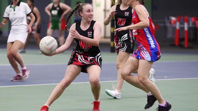 Saints’ Amber Bradtberg looks to pass against Sharks in Round 4 of the Cairns Netball Association Senior Division 1 competition. PICTURE: BRENDAN RADKE