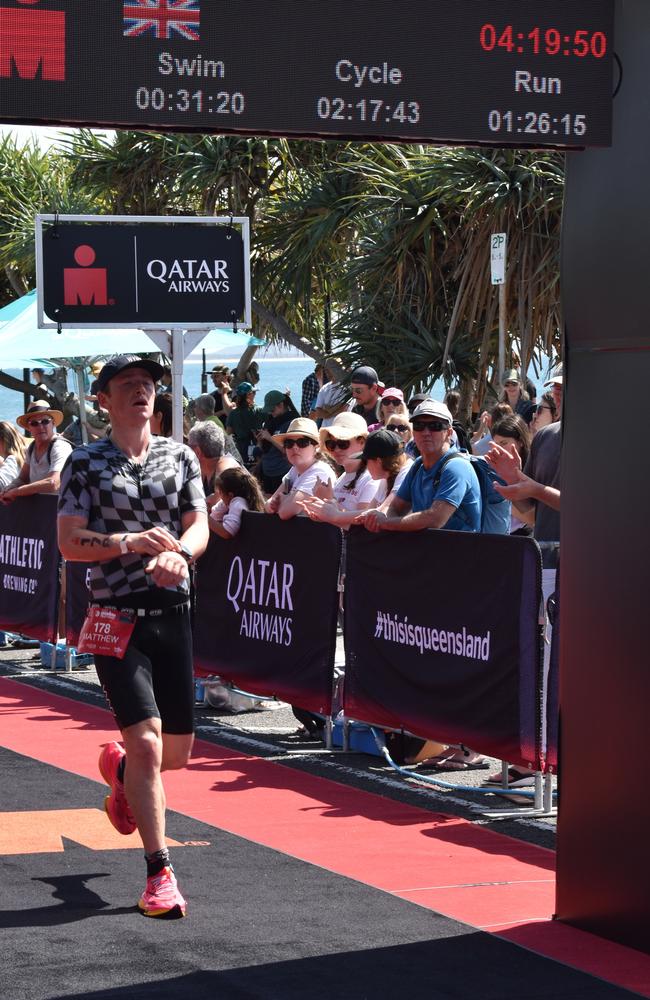 Athletes crossing the finish line at the Sunshine Coast Ironman 70.3 2023.