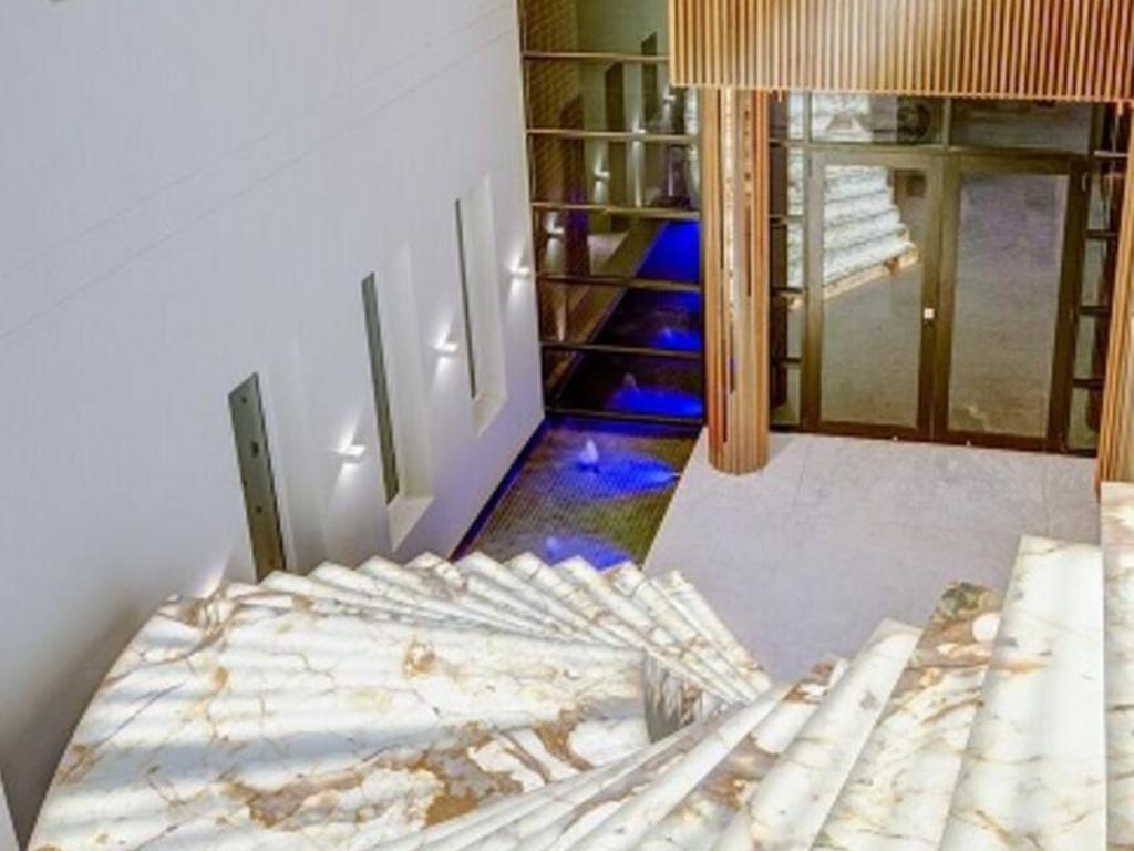 The property features a marble staircase which was once featured in a Bow Wow video. Picture: Realestate.com.au.