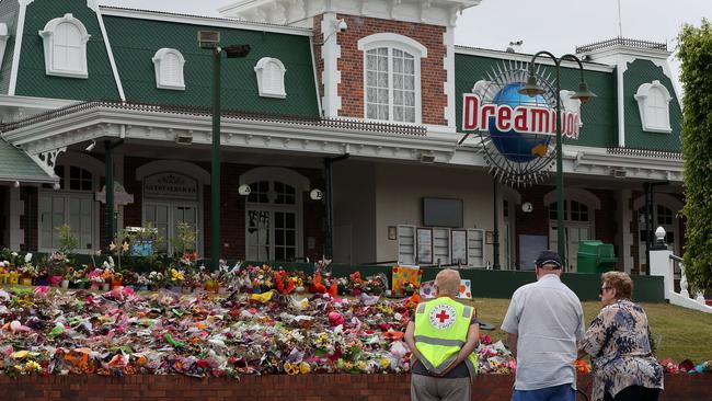 Police and investigators arrive a Dreamworld as the investigation into the Dreamworld ride tragedy continued in 2016. Members of the general public still arrived to pay their respects. Picture by Scott Fletcher