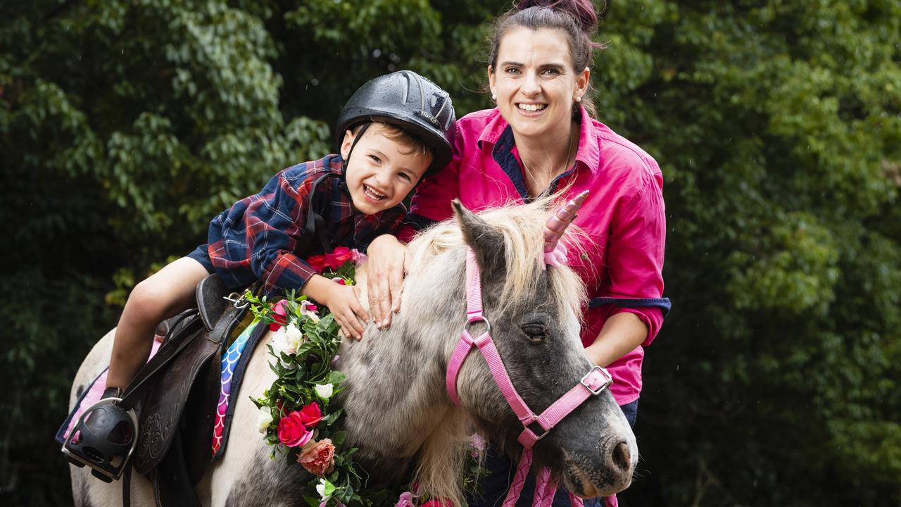 Pony Parties Toowoomba owner Lauren Sykes takes her son Josiah Sykes for a pony ride on Cookie. Picture: Kevin Farmer