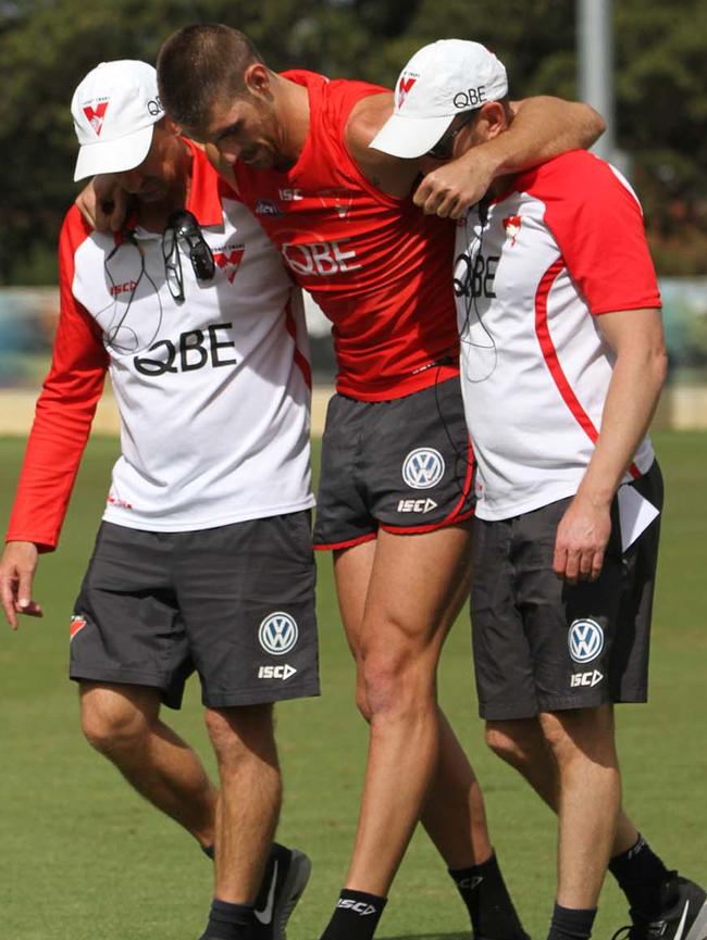 Sam Naismith is helped from the field after hurting his knee. Picture: sydneyswans.com.au