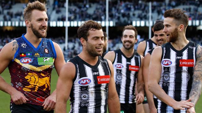 A facial hair-clad group of Magpies after their win over Collingwood. (Photo by Adam Trafford/AFL Media/Getty Images)