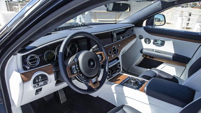 Sleek and sexy interior of the Rolls-Royce, with wooden features and white contrasting leather. Picture: Mark Cranitch.