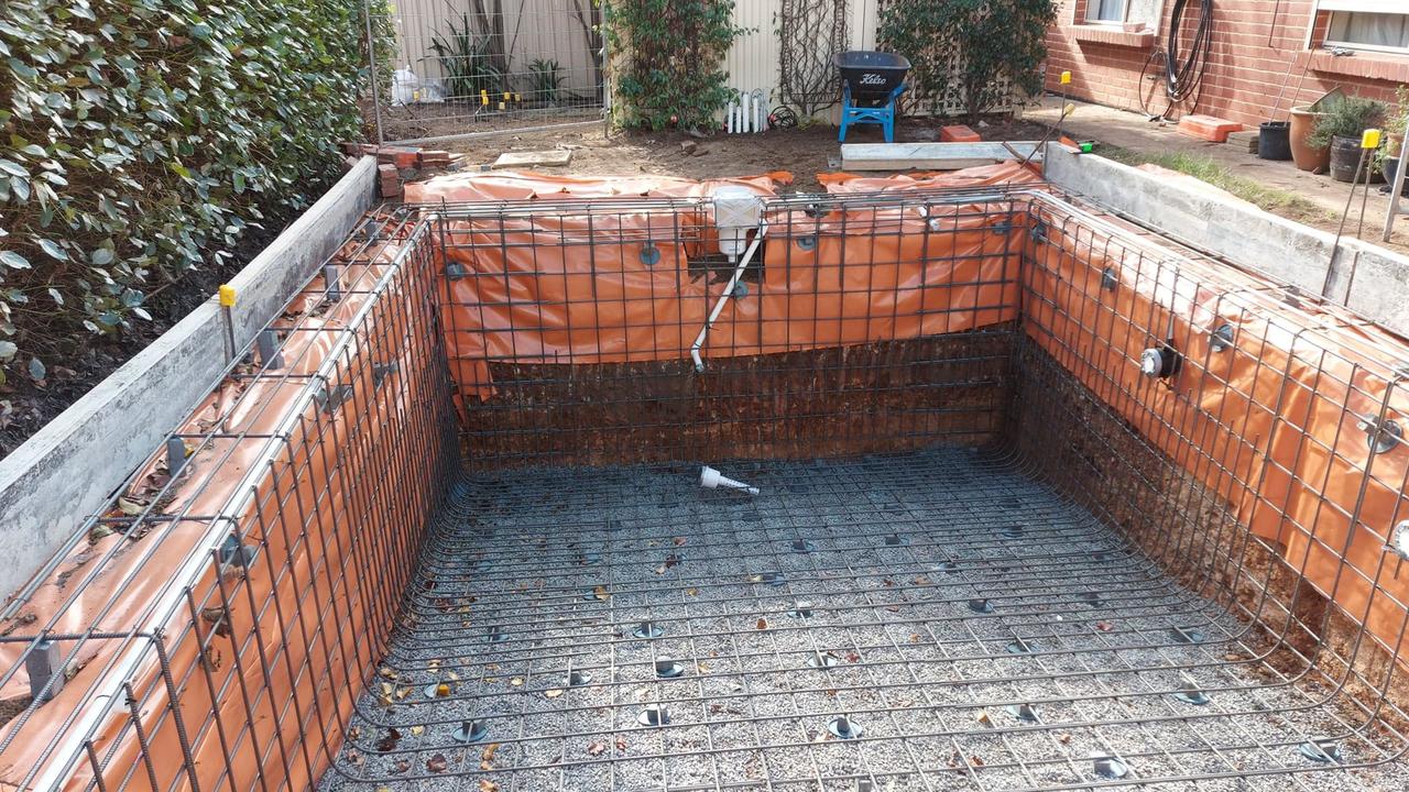 The pool being built.