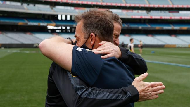 Senior coaches Damien Hardwick of the Tigers and Alastair Clarkson of the Hawks embrace before the match. Picture: Getty Images