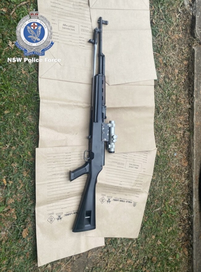 A high-powered rifle fitted with a scope was seized at one of the bikie's properties. Picture: NSW Police