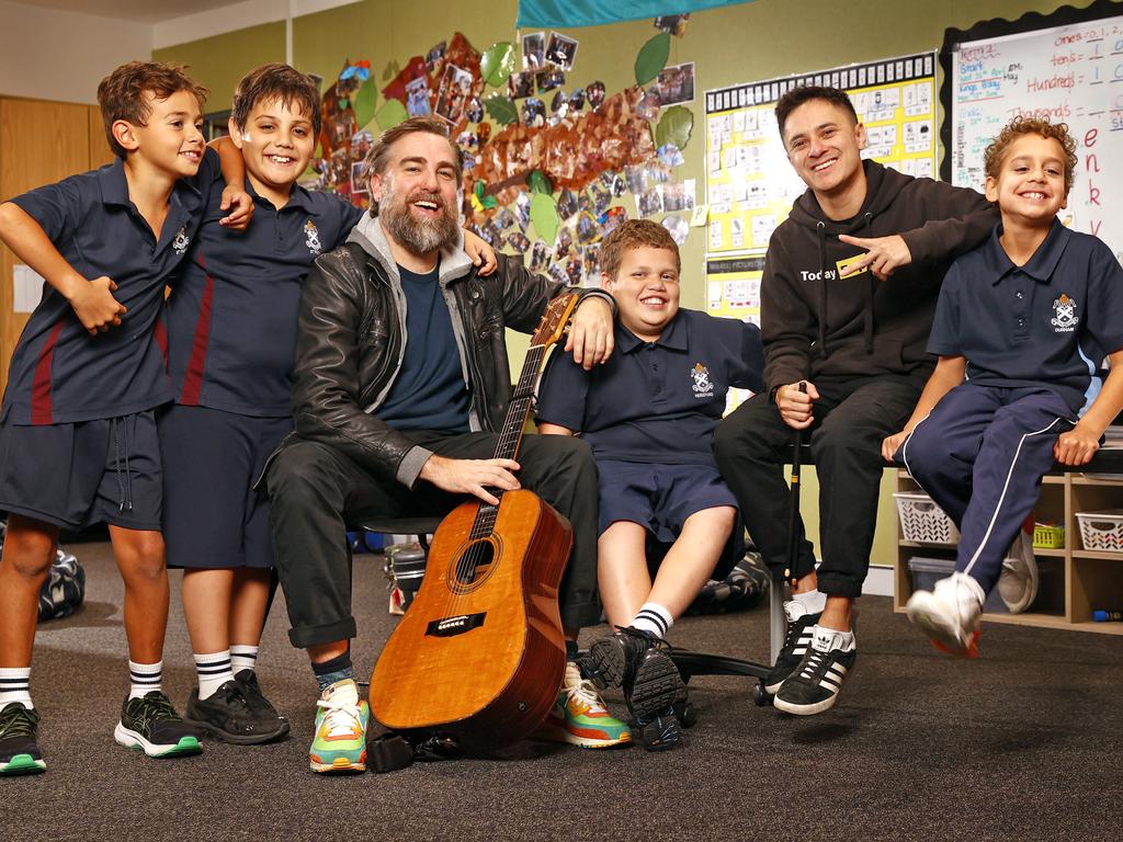 Australian singer-songwriter Josh Pyke and hip hop artist Rhyan Clapham (DOBBY) in Sydney with St Andrew’s Cathedral Gawura School students Yuin-River Johnson, Latrell McGrath, BJ Carr and John Saulo. Picture: Richard Dobson