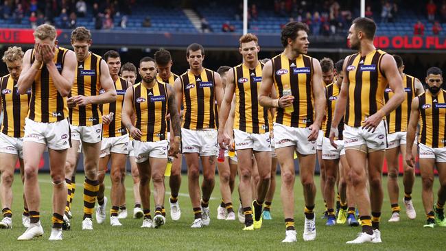 The dejected Hawks leave the field after their loss to Melbourne. Picture: AAP