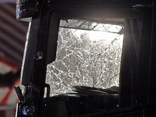 A light shines through the shattered wind screen of a truck which crashed into a Christmas market in Berlin. Picture: AP