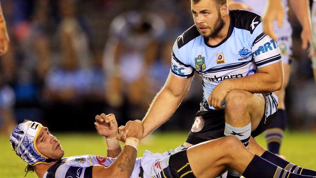 Wade Graham of the Sharks helps up the Cowboys' Johnathan Thurston during the Cronulla Sharks v North Queensland Cowboys NRL round 14 game at Shark Park, Cronulla. pic Mark Evans