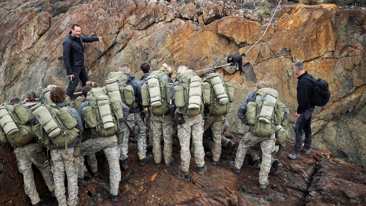 The recruits being told about the rope crawl challenge.