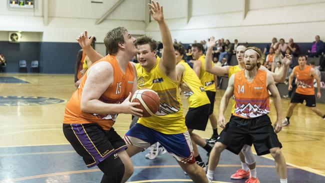 Seth Ham (left) under the basket for Westridge Fruit and Veg Warriors as Jacob Pomfrett defends for Southern Cross Bricklaying Eels. Picture: Kevin Farmer