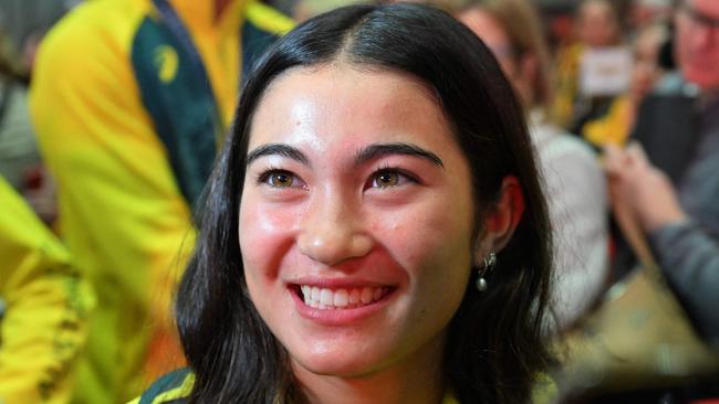 Australian gold medallist skateboarder Arisa Trew smiles as disembarks a chartered flight following Australian athletes return from the Paris 2024 Olympic Games, at the Sydney International Airport on August 14, 2024. (Photo by Saeed KHAN / AFP)