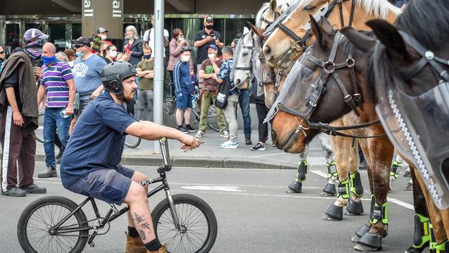 Mounted police face off with protesters. Picture: Jake Nowakowski