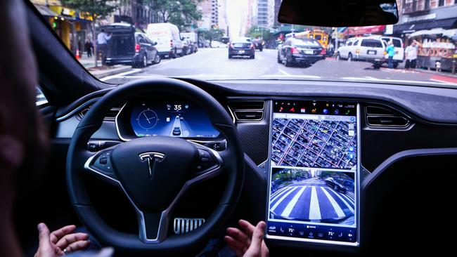 A driver rides in a Tesla Motors Inc. Model S vehicle equipped with Autopilot hardware and software. Picture: Christopher Goodney / Bloomberg News