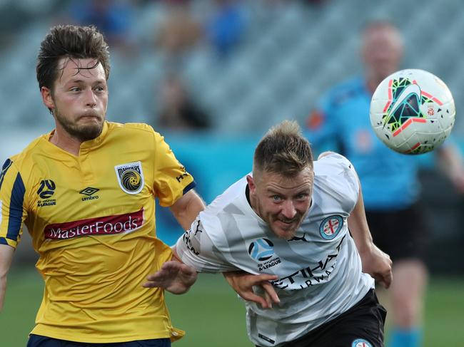 GOSFORD, AUSTRALIA - MARCH 20: Scott Jamieson of Melbourne City and Chris Harold of the Central Coast Mariners contest the ball during the round 24 A-League match between the Central Coast Mariners and Melbourne City at Central Coast Stadium on March 20, 2020 in Gosford, Australia. (Photo by Tony Feder/Getty Images)