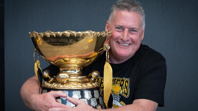 Glenelg head of football Paul Sandercock with the Thomas Seymour Hill premiership trophy the Tigers won on Sunday. Picture: Naomi Jellicoe