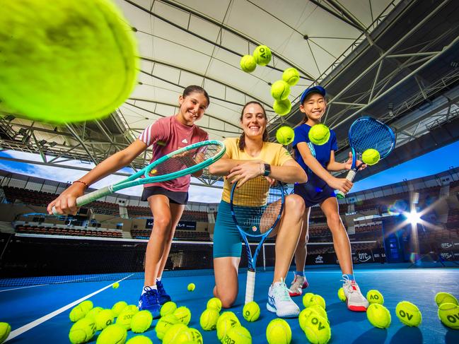 Australian No.1 Kim Birrell with Queensland Junior Tennis kids Eleni Papoulias and Chantelle Lim at Pat Rafter Arena. Picture: Nigel Hallett