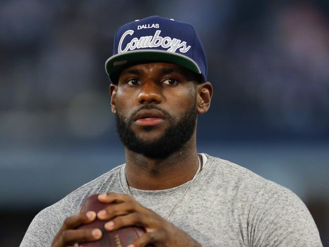 ARLINGTON, TX - SEPTEMBER 08:  NBA player Lebron James of the Miami Heat throws a football at AT&T Stadium before a Sunday night game between the New York Giants and the Dallas Cowboys on September 8, 2013 in Arlington, Texas.  (Photo by Ronald Martinez/Getty Images)