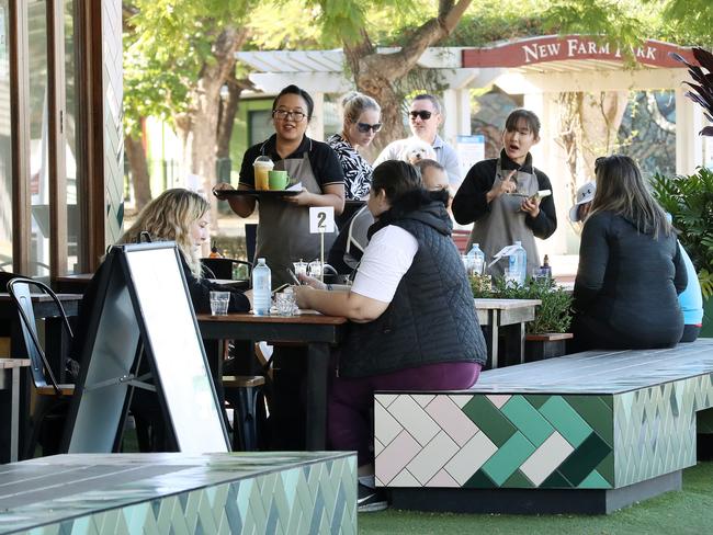Table service at Cafe 63, Sydney St, New farm, People enjoying the new lifted restrictions at Cafes around New Farm. Photographer: Liam Kidston.