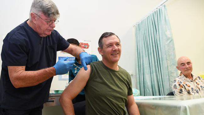 Dr Lionel Crompton gives Chief Minister Michael Gunner the first dose of the coronavirus vaccine, Picture Katrina Bridgeford.