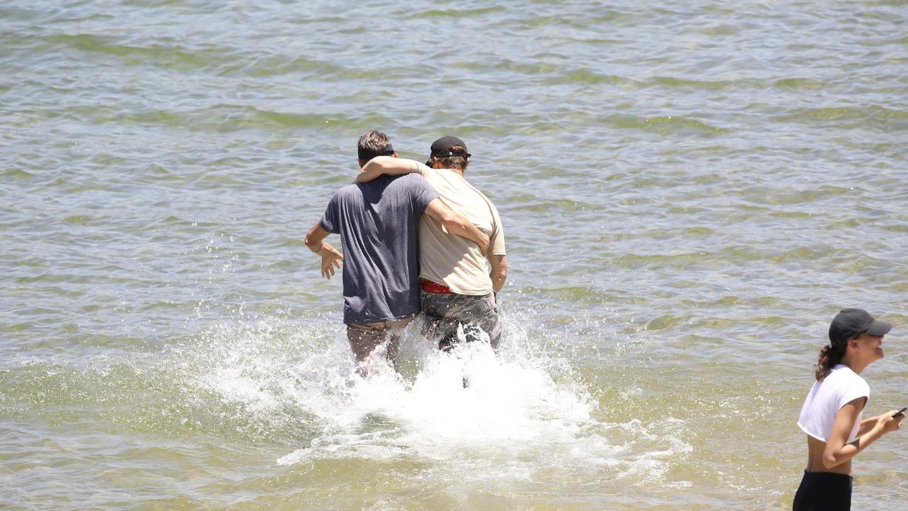 Ryan Dorsey (right) and George Rivera enter the water of Lake Piru. Picture: BACKGRID