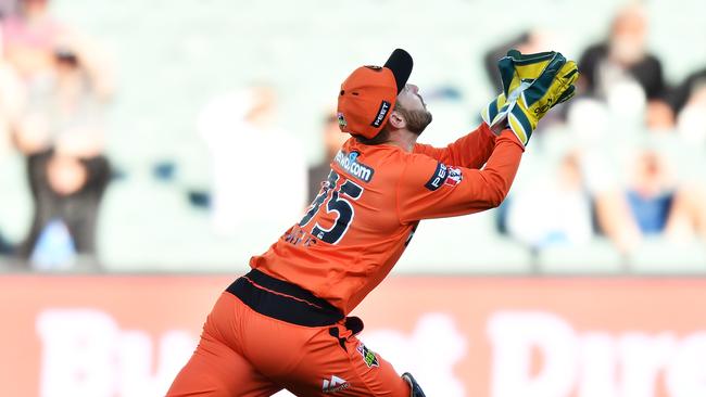 Josh Inglis reels in a catch for Perth Scorchers.